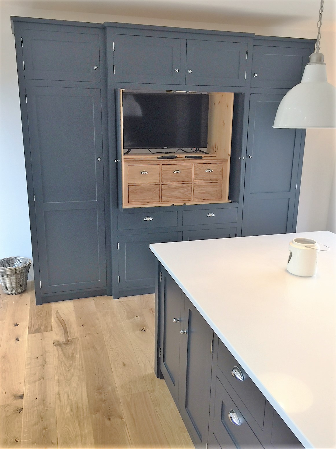 Fully bespoke housekeepers cupboard incorporating integrated fridge, hand built from solid wood.