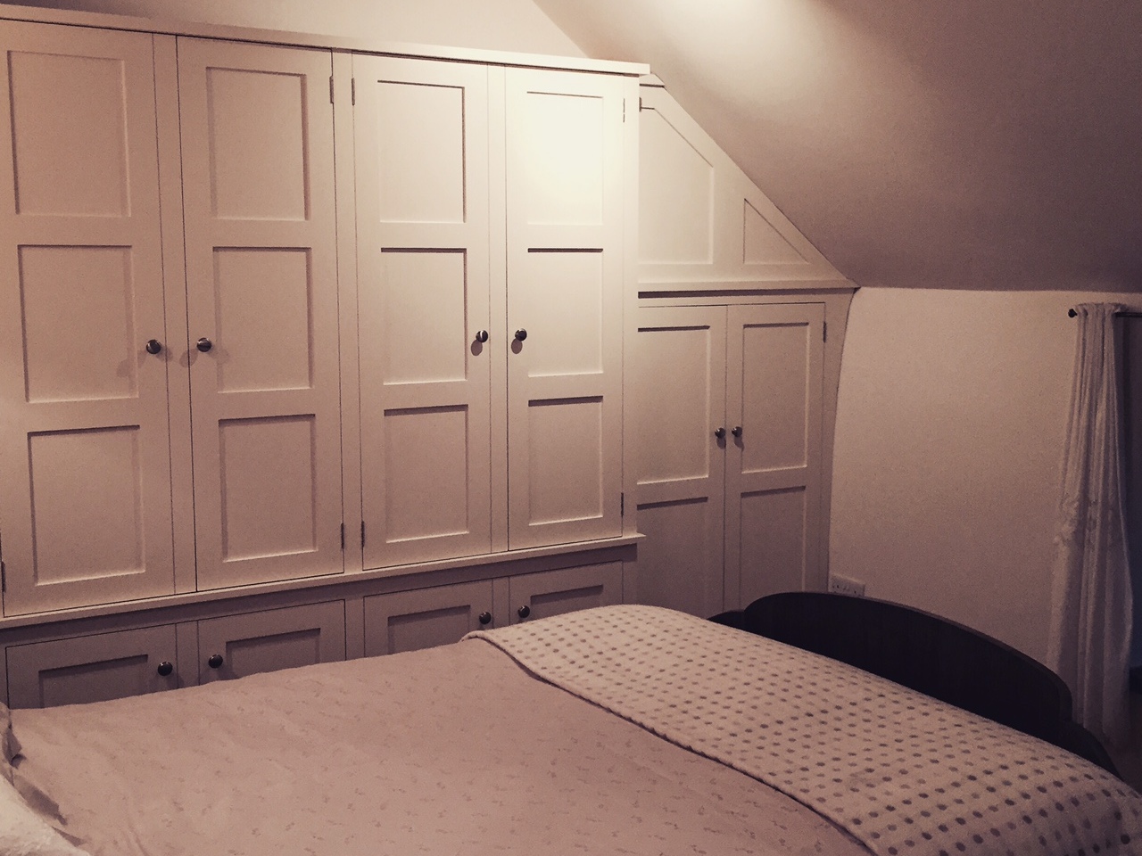 Individually designed fully fitted bedroom furniture hand built from solid wood in shaker style.