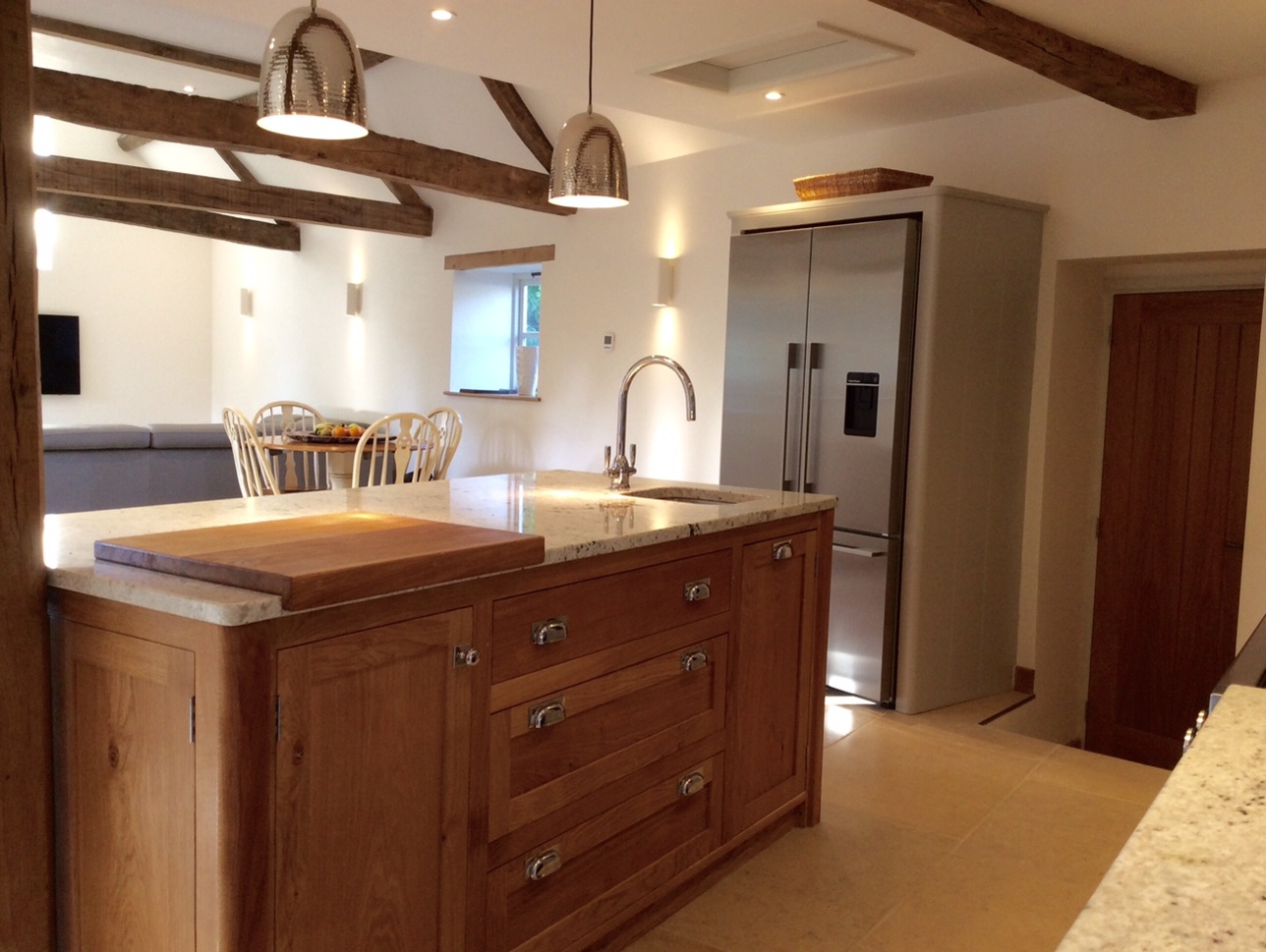 Individually designed island site, shaker style in solid oak.